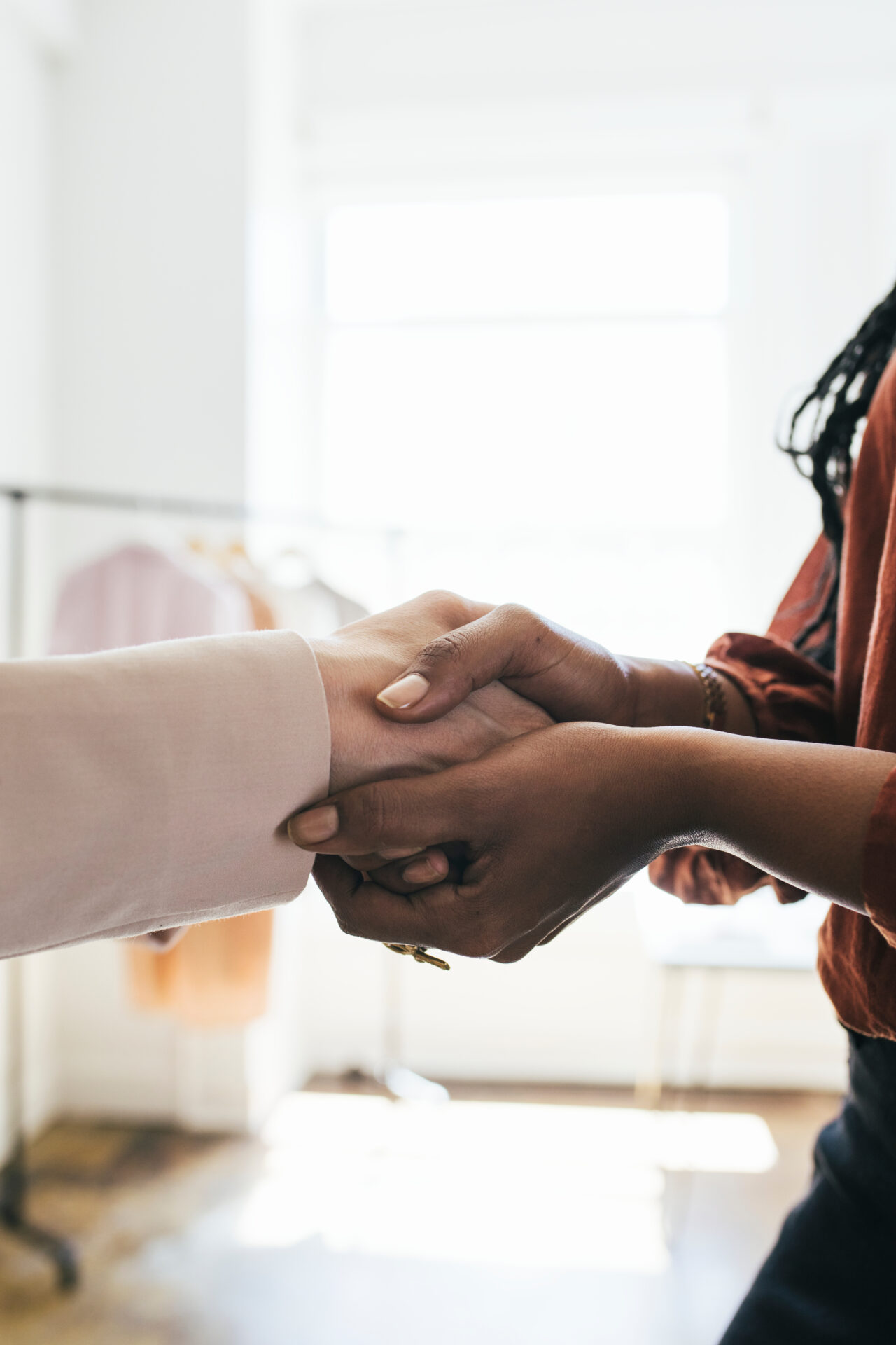 the woman shaking hands with a man